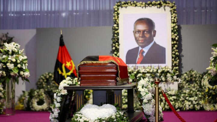 A casket carrying the body of Angola's former president Jose Eduardo dos Santos, who died in Spain in July, lies during his funeral at the Agostinho Neto Memorial in Luanda on August 28, 2022.